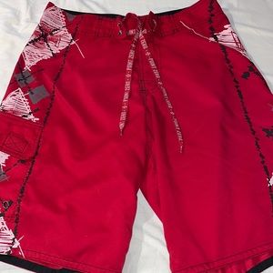 Men’s size small red with black and white designs swim trunks with Velcro front